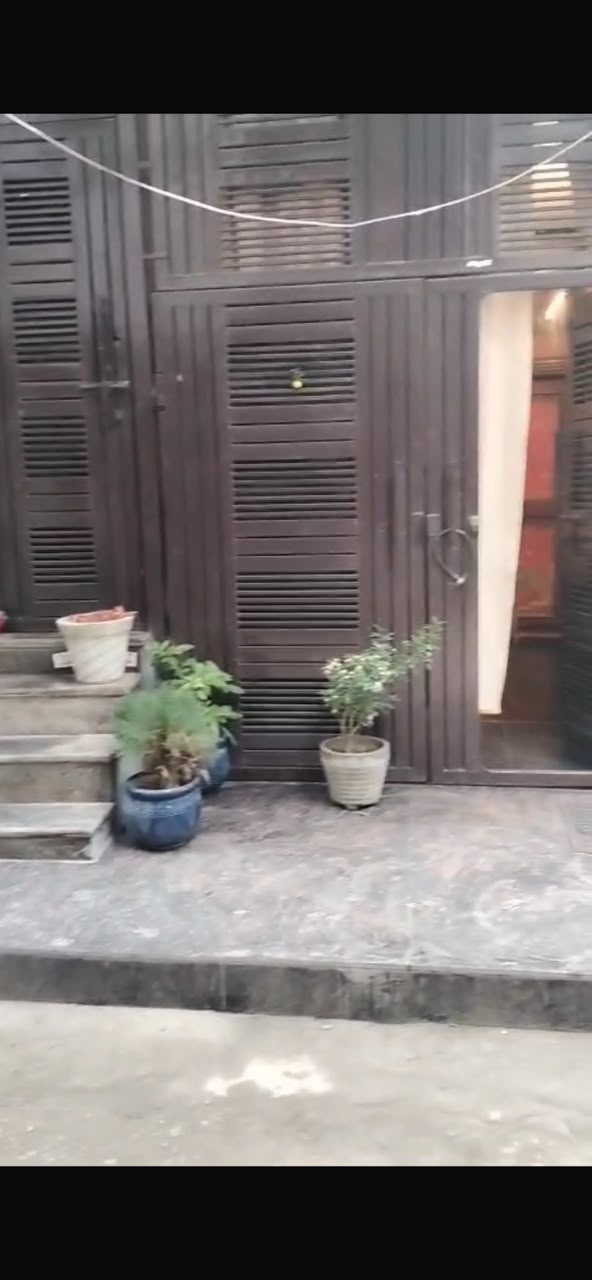 Gated entrance with potted plants