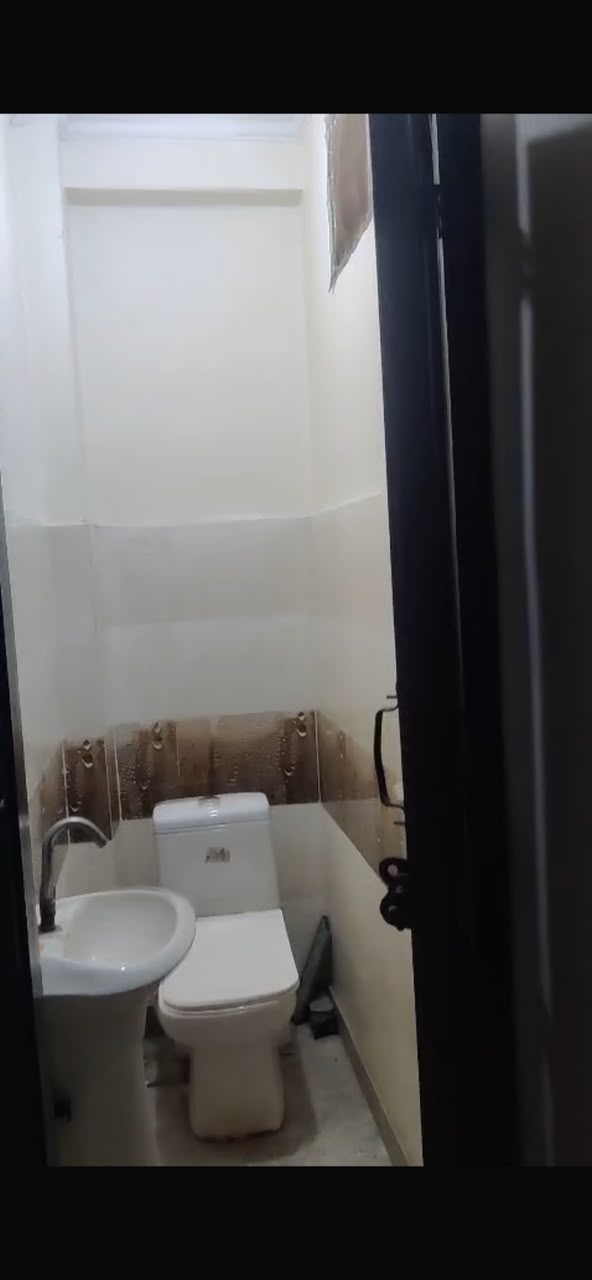 Washroom with tiled flooring